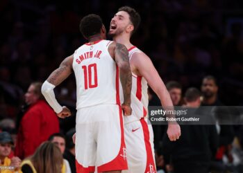 Houston Rockets center Alperen Sengun (28) and forward Jabari Smith Jr. (10) celebrate during the fourth quarter of game five of a Western Conference NBA playoff game against the Los Angeles Lakers (Robert Gauthier / Los Angeles Times via Getty Images)