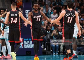 CHARLOTTE, NC - APRIL 14: Tyler Herro #14, Andrew Wiggins #22 and Jaime Jaquez Jr. #11 of the Miami Heat high five during the game against the Charlotte Hornets  during the Play-In Tournament on April 14, 2026 at Spectrum Center in Charlotte, North Carolina. NOTE TO USER: User expressly acknowledges and agrees that, by downloading and or using this photograph, User is consenting to the terms and conditions of the Getty Images License Agreement. Mandatory Copyright Notice: Copyright 2026 NBAE (Photo by Joe Murphy/NBAE via Getty Images)