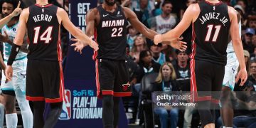 CHARLOTTE, NC - APRIL 14: Tyler Herro #14, Andrew Wiggins #22 and Jaime Jaquez Jr. #11 of the Miami Heat high five during the game against the Charlotte Hornets  during the Play-In Tournament on April 14, 2026 at Spectrum Center in Charlotte, North Carolina. NOTE TO USER: User expressly acknowledges and agrees that, by downloading and or using this photograph, User is consenting to the terms and conditions of the Getty Images License Agreement. Mandatory Copyright Notice: Copyright 2026 NBAE (Photo by Joe Murphy/NBAE via Getty Images)