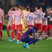 Lamine Yamal of FC Barcelona reacts by crouching with his head down, looking at the grass following his team’s defeat to Club Atlético de Madrid during the UEFA Champions League 2025/26 Quarter-Final First Leg match between FC Barcelona and Club Atlético de MADRID (Photo by Pedro Salado/Getty Images)