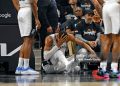 Victor Wembanyama #1 of the San Antonio Spurs holds his head after falling to the court against the Portland Trailblazers in the first half  of Game Two of the Western Conference First Round NBA Playoffs (Photo by Ronald Cortes/Getty Images)