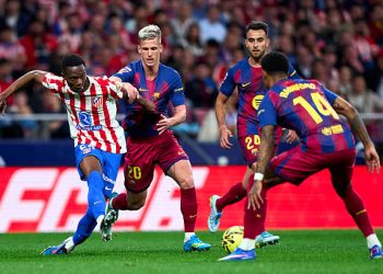 Taufik Seidu of Atletico de Madrid battle for the ball with Dani Olmo of FC Barcelona. Photo by Diego Souto/Getty Images