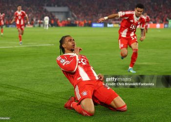 Michael Olise of Bayern Munich celebrates scoring a goal to make the score 4-3 with his team-mates during the UEFA Champions League 2025/26 Quarter-Final Second Leg match between FC Bayern M¸nchen and Real Madrid (Photo by Chris Brunskill/Fantasista/Getty Images)
