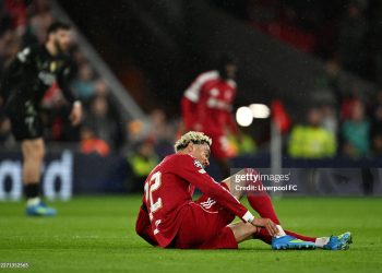 Hugo Ekitike of Liverpool holds his ankle as he appears to be injured during the UEFA Champions League 2025/26 Quarter-Final Second Leg match between Liverpool FC and Paris Saint-Germain FC (Photo by Liverpool FC/Liverpool FC via Getty Images)