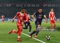 Michael Olise of Bayern Munich competes with Marquinhos of Paris Saint-Germain during the UEFA Champions League 2025/26 Semi Final First Leg match between Paris Saint-Germain and Bayern Munich (Photo by Chris Brunskill/Fantasista/Getty Images)