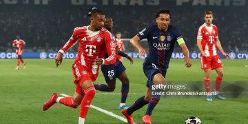 Michael Olise of Bayern Munich competes with Marquinhos of Paris Saint-Germain during the UEFA Champions League 2025/26 Semi Final First Leg match between Paris Saint-Germain and Bayern Munich (Photo by Chris Brunskill/Fantasista/Getty Images)