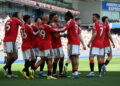 Patrick Dorgu of Manchester United celebrates scoring his team's first goal with teammates during the Premier League match between Brighton & Hove Albion and Manchester United at the Amex Stadium on May 24, 2026 in Brighton, England. (Photo by Mike Hewitt/Getty Images)