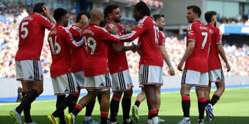 Patrick Dorgu of Manchester United celebrates scoring his team's first goal with teammates during the Premier League match between Brighton & Hove Albion and Manchester United at the Amex Stadium on May 24, 2026 in Brighton, England. (Photo by Mike Hewitt/Getty Images)