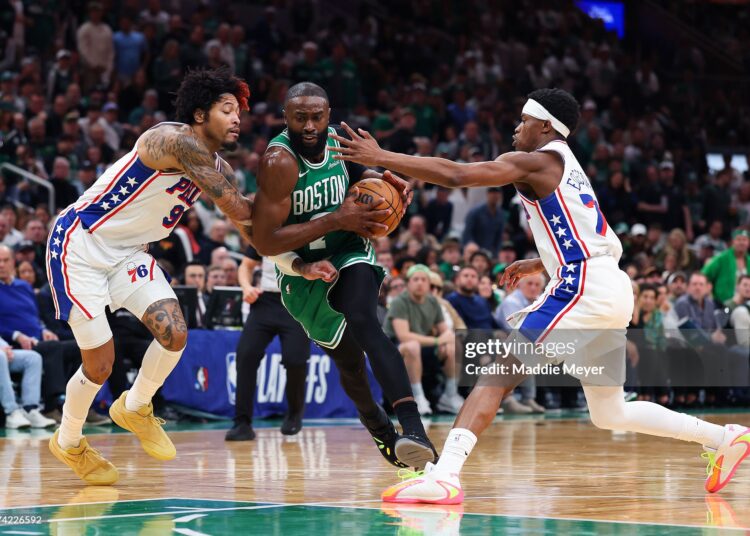 Jaylen Brown #7 of the Boston Celtics drives to the basket against Vj Edgecombe #77 and Kelly Oubre Jr. #9 of the Philadelphia 76ers during the third quarter in Game Seven of the First Round of the NBA Eastern Conference Playoffs (Photo by Maddie Meyer/Getty Images)