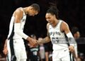 Victor Wembanyama #1  and Devin Vassell #24 of the San Antonio Spurs celebrate during the second quarter of a game against the Minnesota Timberwolves in Game Six of the Second Round of the NBA Western Conference Playoffs (Photo by David Berding/Getty Images)