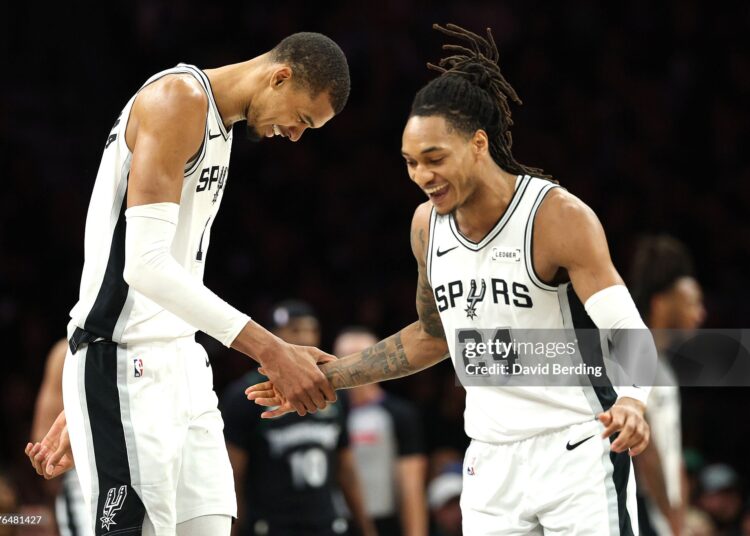Victor Wembanyama #1  and Devin Vassell #24 of the San Antonio Spurs celebrate during the second quarter of a game against the Minnesota Timberwolves in Game Six of the Second Round of the NBA Western Conference Playoffs (Photo by David Berding/Getty Images)
