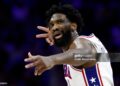Philadelphia 76ers center Joel Embiid reacts after making a 3-pointer in the second quarter. The Boston Celtics played the Philadelphia 76ers in the first round of the NBA Playoffs (Photo by Danielle Parhizkaran/The Boston Globe via Getty Images)