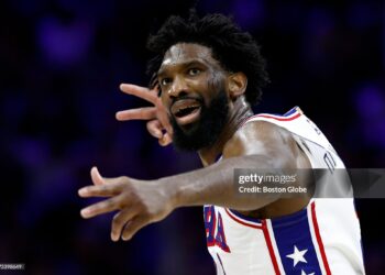 Philadelphia 76ers center Joel Embiid reacts after making a 3-pointer in the second quarter. The Boston Celtics played the Philadelphia 76ers in the first round of the NBA Playoffs (Photo by Danielle Parhizkaran/The Boston Globe via Getty Images)