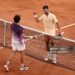 Joao Fonseca of Brazil and Novak Djokovic of Serbia interact at the net following their Men's Singles third round match on Day Six of the 2026 French Open (Photo by James Fearn/Getty Images)