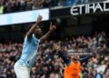Manchester City's Belgian midfielder #11 Jeremy Doku (L) celebrates after scoring the opening goal during the English Premier League football match between Manchester City and Brentford (Photo by Darren Staples / AFP via Getty Images)