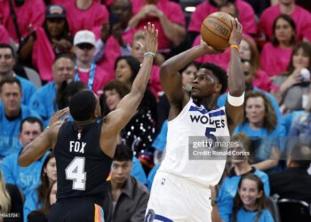 Anthony Edwards #5 of the Minnesota Timberwolves shoots the ball against De'aaron Fox #4 of the San Antonio Spurs during the first half of a game in Game One of the Second Round of the NBA Western Conference Playoffs at Frost Bank Center (Photo by Ronald Cortes/Getty Images)