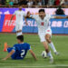 Iran's Mahdi Torabi (16) is reacting while Uzbekistan's Abdukodir Khusanov (2) is lying on the pitch during the FIFA World Cup 26 AFC qualifying round two group E soccer match at the Azadi (Freedom) Stadium in Tehran, Iran, on June 11, 2024. (Photo by Morteza Nikoubazl/NurPhoto via Getty Images)