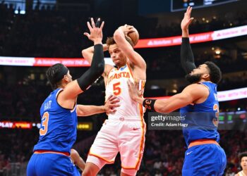 Dyson Daniels #5 of the Atlanta Hawks looks to pass the ball during the game against the New York Knicks during Round One Game Six of the 2026 NBA Playoffs (Photo by Adam Hagy/NBAE via Getty Images)