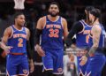 Karl-Anthony Towns #32, Miles McBride #2 and Jose Alvarado #5 of the New York Knicks reacts to the score during the third quarter of a game against the Atlanta Hawks in Game Six of the First Round of the NBA Eastern Conference Playoffs (Photo by Kevin C. Cox/Getty Images)