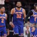 Karl-Anthony Towns #32, Miles McBride #2 and Jose Alvarado #5 of the New York Knicks reacts to the score during the third quarter of a game against the Atlanta Hawks in Game Six of the First Round of the NBA Eastern Conference Playoffs (Photo by Kevin C. Cox/Getty Images)