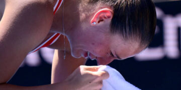Ukraine's Marta Kostyuk cries. (Photo by YUICHI YAMAZAKI/AFP via Getty Images)