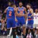 Miles McBride #2, Mikal Bridges #25 and Jose Alvarado #5 of the New York Knicks high five during the game against the Philadelphia 76ers during Round Two Game Four of the 2026 NBA Playoffs  (Photo by Jesse D. Garrabrant/NBAE via Getty Images)
