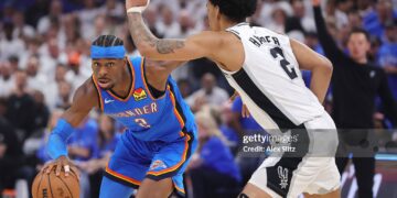 Shai Gilgeous-Alexander #2 of the Oklahoma City Thunder drives around Dylan Harper #2 of the San Antonio Spurs during the first quarter in Game Two of the NBA Western Conference Finals (Photo by Alex Slitz/Getty Images)