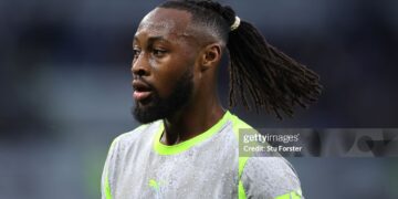 Manchester City player Antoine Semenyo looks on wearing the grey Puma away strip during the Premier League match between Everton and Manchester City (Photo by Stu Forster/Getty Images)