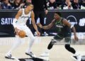 Victor Wembanyama #1 of the San Antonio Spurs handles the ball while defended by Anthony Edwards #5 of the Minnesota Timberwolves during the game during Round Two Game Two (Photos by David Sherman/NBAE via Getty Images)