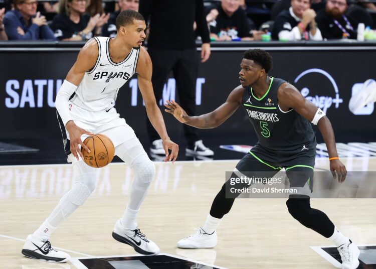 Victor Wembanyama #1 of the San Antonio Spurs handles the ball while defended by Anthony Edwards #5 of the Minnesota Timberwolves during the game during Round Two Game Two (Photos by David Sherman/NBAE via Getty Images)