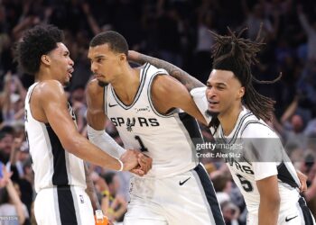 Victor Wembanyama #1 of the San Antonio Spurs is congratulated by Dylan Harper #2 and Stephon Castle #5 after scoring a basket against the Oklahoma City Thunder during the second quarter in Game Four of the NBA Western Conference Finals (Photo by Alex Slitz/Getty Images)