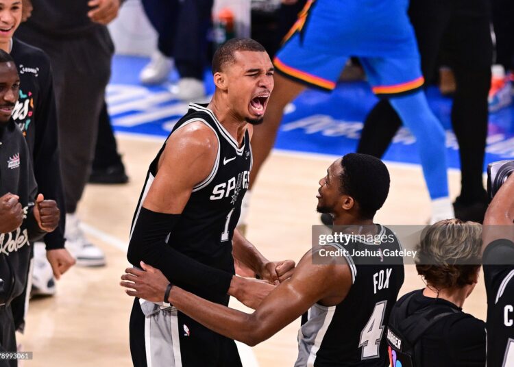 Victor Wembanyama #1 of the San Antonio Spurs celebrates with De'aaron Fox #4 after defeating the Oklahoma City Thunder with a score of 111 to 103 to win Game Seven of the NBA Western Conference Finals (Photo by Joshua Gateley/Getty Images)