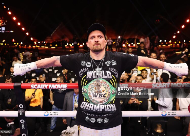 Oleksandr Usyk celebrates after beating Rico Verhoeven in their WBC World Heavyweight  Title during the Glory in Giza - Fight Night (Photo by Mark Robinson/Getty Images).