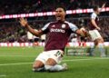 Ollie Watkins of Aston Villa celebrates scoring his team's third goal during the Premier League match between Aston Villa and Liverpool (Photo by Neville Williams/Aston Villa FC via Getty Images)