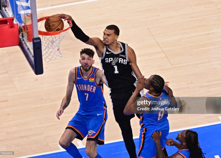 Victor Wembanyama #1 of the San Antonio Spurs dunks the ball against Chet Holmgren #7 and Jalen Williams #8 of the Oklahoma City Thunder during the second quarter in Game One of the NBA Western Conference Finals  (Photo by Joshua Gateley/Getty Images)
