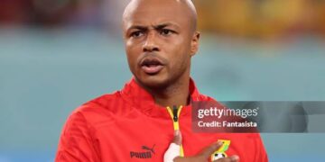 Andre Ayew of Ghana reacts during the line up for the National anthems prior to kick off in the FIFA World Cup Qatar 2022 Group H match between Ghana and Uruguay at Al Janoub Stadium on December 02, 2022 in Al Wakrah, Qatar. (Photo by Youssef Loulidi/Fantasista/Getty Images)