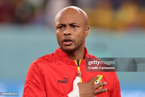 Andre Ayew of Ghana reacts during the line up for the National anthems prior to kick off in the FIFA World Cup Qatar 2022 Group H match between Ghana and Uruguay at Al Janoub Stadium on December 02, 2022 in Al Wakrah, Qatar. (Photo by Youssef Loulidi/Fantasista/Getty Images)