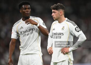 Aurelien Tchouameni and Federico Valverde of Real Madrid look on during the LaLiga EA Sports match between Real Madrid CF and Girona FC (Photo by Denis Doyle/Getty Images)