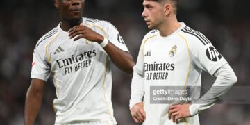 Aurelien Tchouameni and Federico Valverde of Real Madrid look on during the LaLiga EA Sports match between Real Madrid CF and Girona FC (Photo by Denis Doyle/Getty Images)