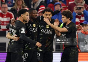 Paris Saint-Germain's French forward #10 Ousmane Dembele (2L) celebrates scoring his team's first goal with team mates during the UEFA Champions League second-leg, semi-final football match between FC Bayern Munich and Paris Saint-Germain (PSG) (Photo by FRANCK FIFE / AFP via Getty Images)
