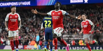 Bukayo Saka of Arsenal celebrates scoring his team's first goal during the UEFA Champions League 2025/26 Semi Final Second Leg match between Arsenal FC and Atletico de Madrid (Photo by Stuart MacFarlane/Arsenal FC via Getty Images)