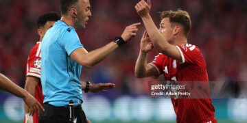 Joshua Kimmich of FC Bayern Munich reacts towards Referee Joao Pinheiro as he appeals for a penalty during the UEFA Champions League 2025/26 Semi Final Second Leg match between FC Bayern München and Paris Saint-Germain (Photo by Adam Pretty/Getty Images)