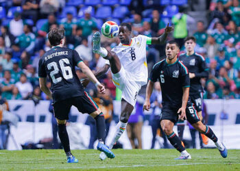 PUEBLA, MEXICO - MAY 22: Brian Gutierrez (L) and Erik Lira (R) of Mexico fight for the ball with Majeed Ashimeru (C) of Ghana during the international friendly match between Mexico and Ghana at Estadio Cuauhtemoc on May 22, 2026 in Puebla, Mexico. Photo by Luis Cano/Jam Media/Getty Images