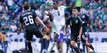 PUEBLA, MEXICO - MAY 22: Brian Gutierrez (L) and Erik Lira (R) of Mexico fight for the ball with Majeed Ashimeru (C) of Ghana during the international friendly match between Mexico and Ghana at Estadio Cuauhtemoc on May 22, 2026 in Puebla, Mexico. Photo by Luis Cano/Jam Media/Getty Images