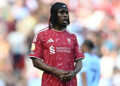 Liverpool's Dutch defender #30 Jeremie Frimpong looks on during the English Premier League football match between Liverpool and Brentford at Anfield in Liverpool, north west England on May 24, 2026. (Photo by Paul ELLIS / AFP via Getty Images) / RESTRICTED TO EDITORIAL USE. No use with unauthorized audio, video, data, fixture lists, club/league logos or 'live' services. Online in-match use limited to 120 images. An additional 40 images may be used in extra time. No video emulation. Social media in-match use limited to 120 images. An additional 40 images may be used in extra time. No use in betting publications, games or single club/league/player publications. /