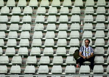 A Juventus' supporter waits for the match to restart after a suspension during the Italian Serie A football match between Torino and Juventus at the Olympic Grande Torino stadium in Turin on May 24, 2026. (Photo by MARCO BERTORELLO / AFP via Getty Images)