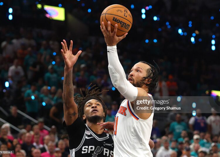 Jalen Brunson #11 of the New York Knicks shoots the ball against Stephon Castle #5 of the San Antonio Spurs during the fourth quarter in Game One of the 2026 NBA Finals (Photo by Gregory Shamus/Getty Images)