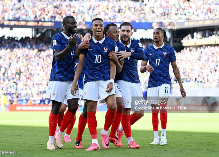 EAST RUTHERFORD, NEW JERSEY - JUNE 16: Kylian Mbappe #10 of France celebrates with teammates after scoring the team's second goal during the FIFA World Cup 2026 Group I match between France and Senegal at New York New Jersey Stadium on June 16, 2026 in East Rutherford, New Jersey. (Photo by Shaun Botterill - FIFA/FIFA via Getty Images)