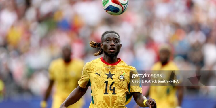 FOXBOROUGH, MASSACHUSETTS - JUNE 23: Gideon Mensah #14 of Ghana chases the ball during the FIFA World Cup 2026 Group L match between England and Ghana at Boston Stadium on June 23, 2026 in Foxborough, Massachusetts. (Photo by Patrick Smith - FIFA/FIFA via Getty Images)
