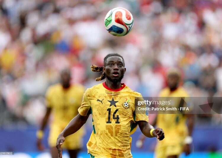 FOXBOROUGH, MASSACHUSETTS - JUNE 23: Gideon Mensah #14 of Ghana chases the ball during the FIFA World Cup 2026 Group L match between England and Ghana at Boston Stadium on June 23, 2026 in Foxborough, Massachusetts. (Photo by Patrick Smith - FIFA/FIFA via Getty Images)